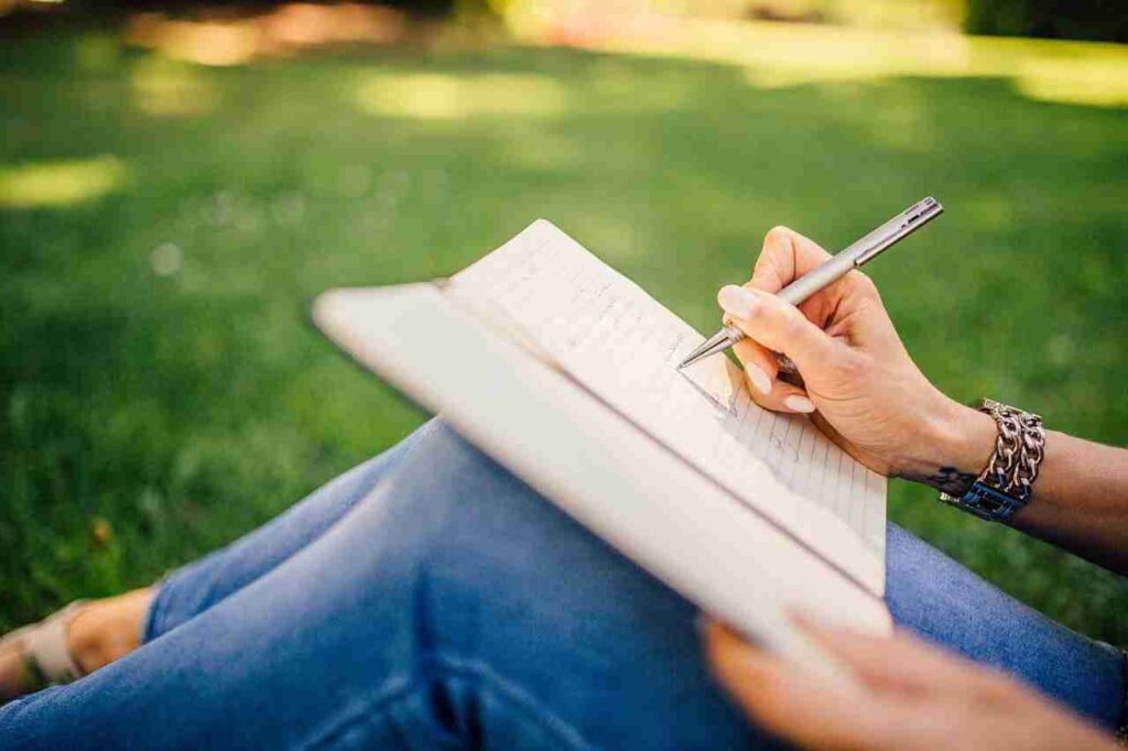 Journaling, Sitting on lawn writing in my blog